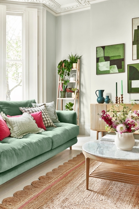 Sage Green Sofa in Boho Living Room with Scalloped Edge Jute Rug