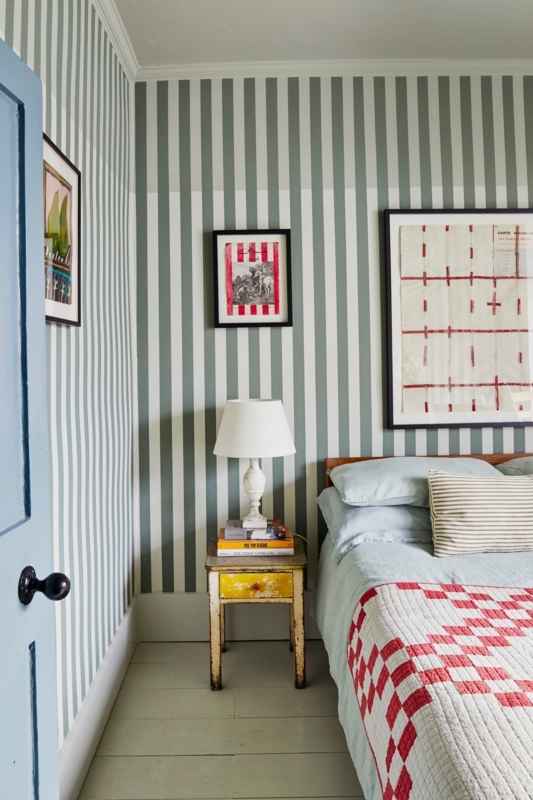 Sage Green Striped Wallpaper Bedroom and Distressed Yellow Nightstand.