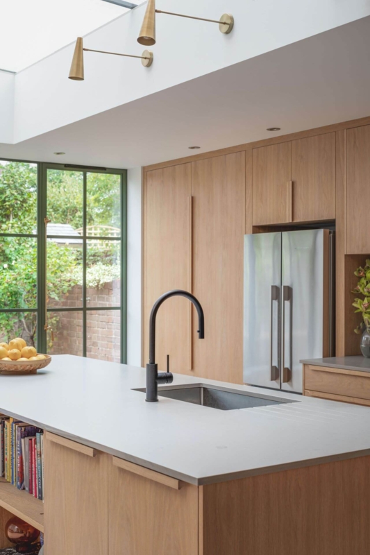 Sage Green Window Frame Kitchen with Vertical Grain Cabinets