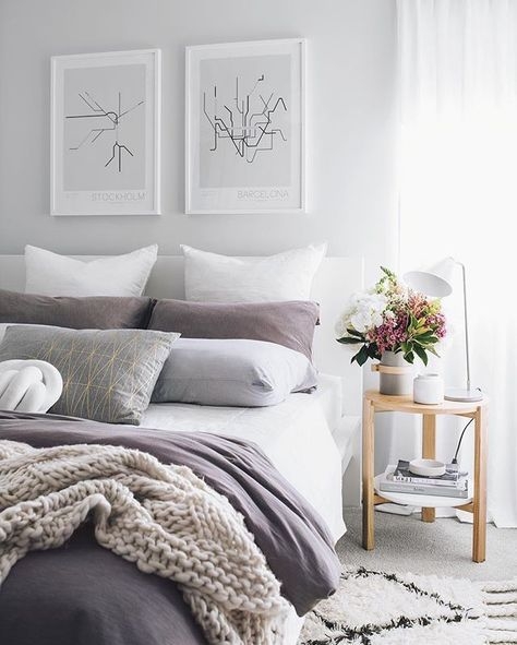Scandinavian Bed with Layered Mauve and Grey Bedding and City Map Art