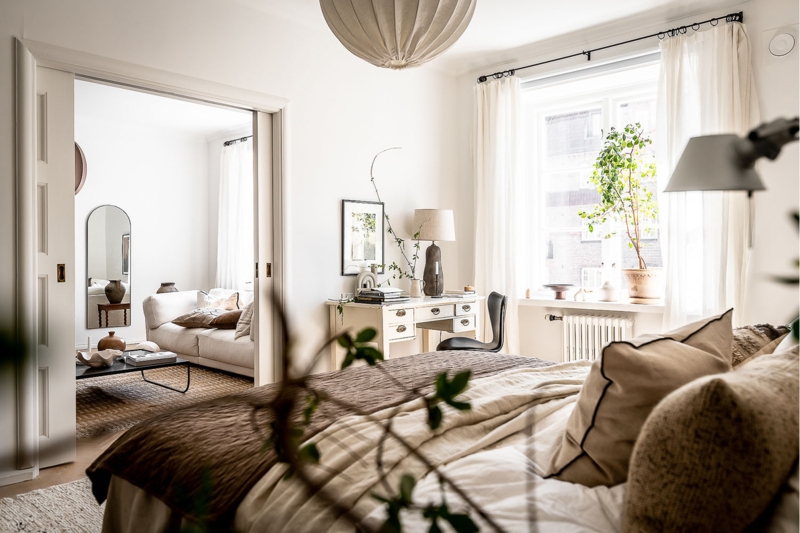 Scandinavian Bedroom with Vintage Desk and Sliding Door Layout