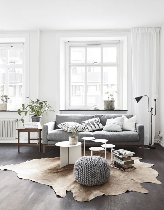 Scandinavian Grey Floor Living Room: Nesting Tables & Hide Rug