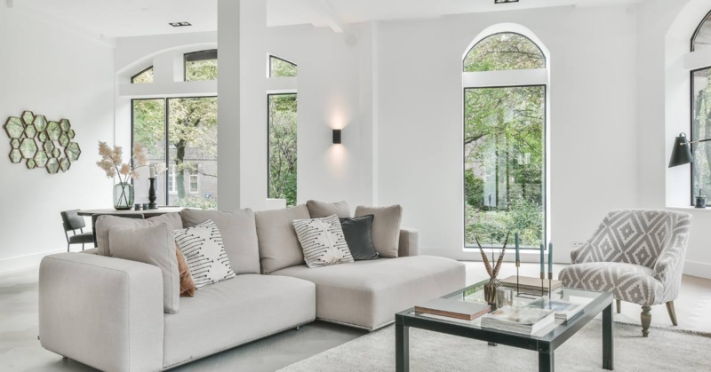Scandinavian Living Room Layout with Large Arched Window Decor & Sectional
