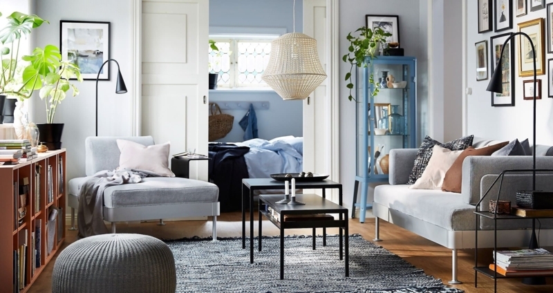Scandinavian Living Room Layout with Soft Blue Walls and Woven Pendant