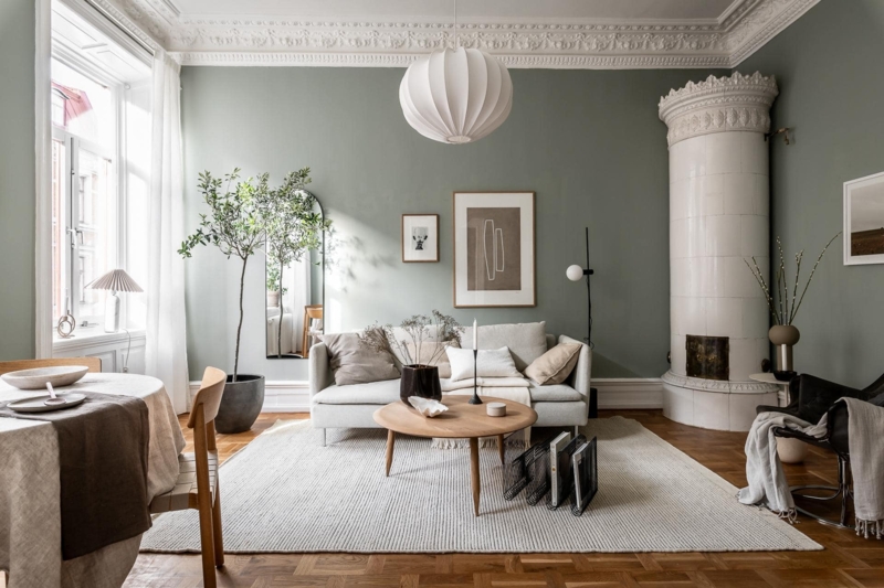 Scandinavian Living Room with Traditional Tiled Stove and Parquet