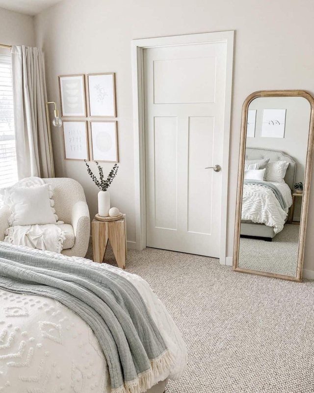 Scandinavian Modern Bedroom with Tan Wool Carpet and Boucle Accent Chair