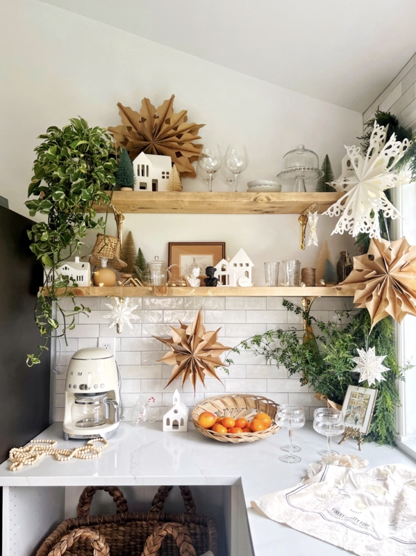 Scandinavian Open Shelving with Paper Star and Ceramic House Decor