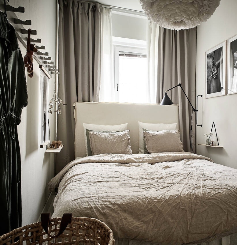 Scandinavian Small Bedroom With Vertical Wall Hooks For Clothes