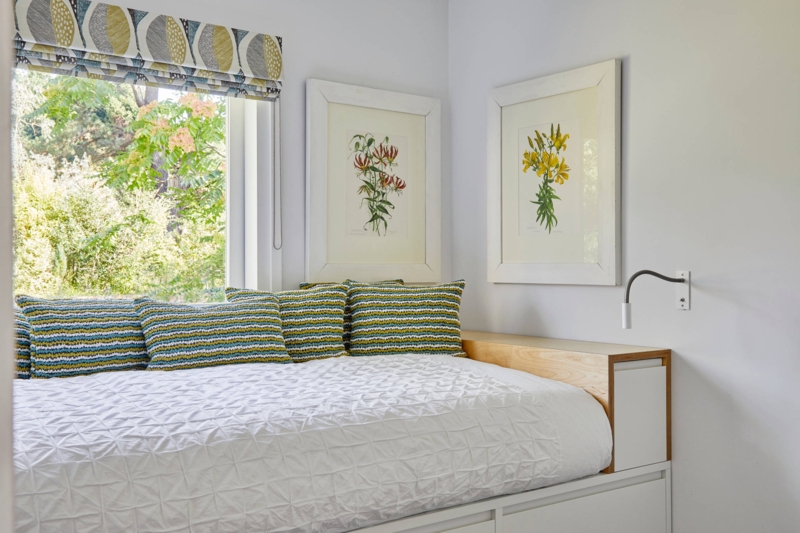 Scandinavian White Daybed With Window-Side Placement and Quilted Bedding