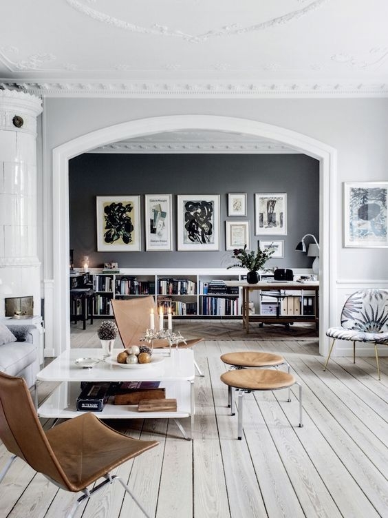 Scandinavian Whitewashed Grey Floor with Arched Doorway & Accent Wall