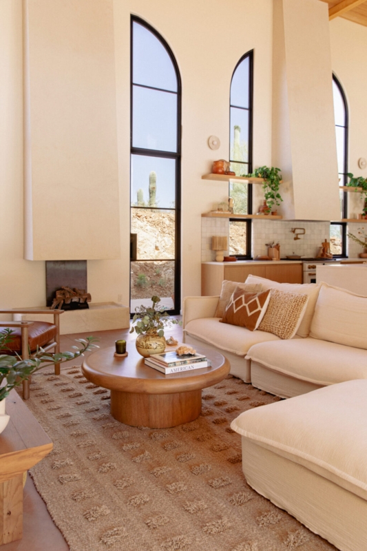Sectional Sofa in Living Room with Arched Windows and Grid Tufted Rug