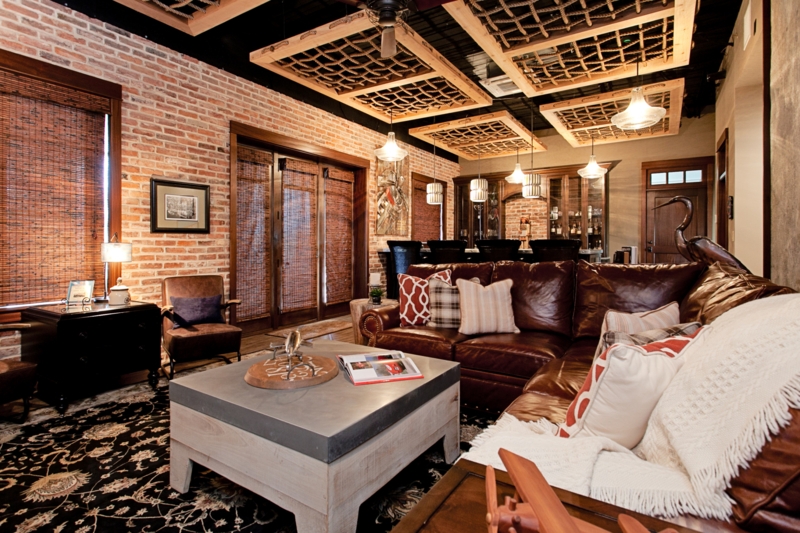 Sectional Sofa Lounge featuring Unique Rope Ceiling Grids and Brick