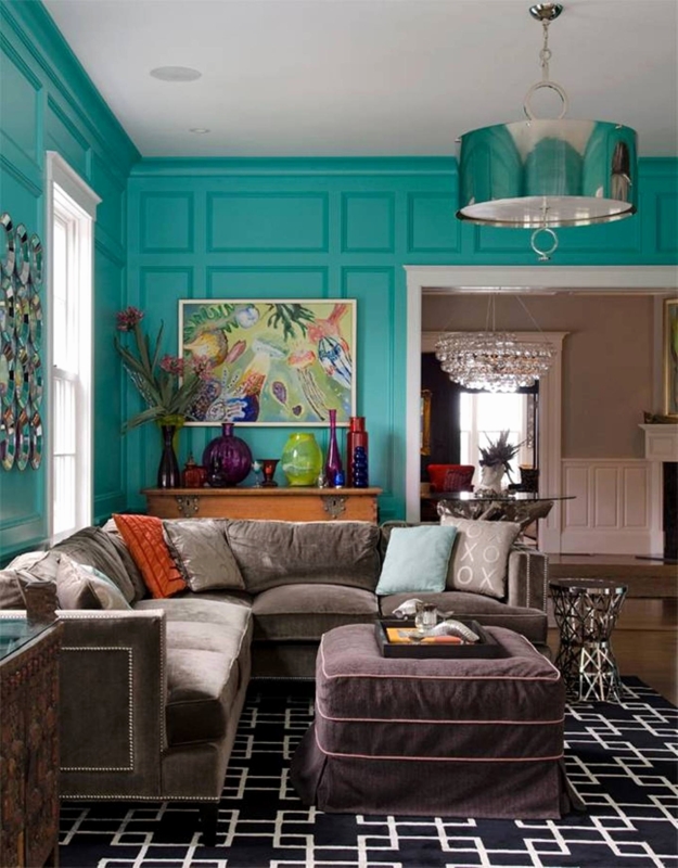 Sectional Sofa with Bold Teal Paneled Walls and Greek Key Rug Accents