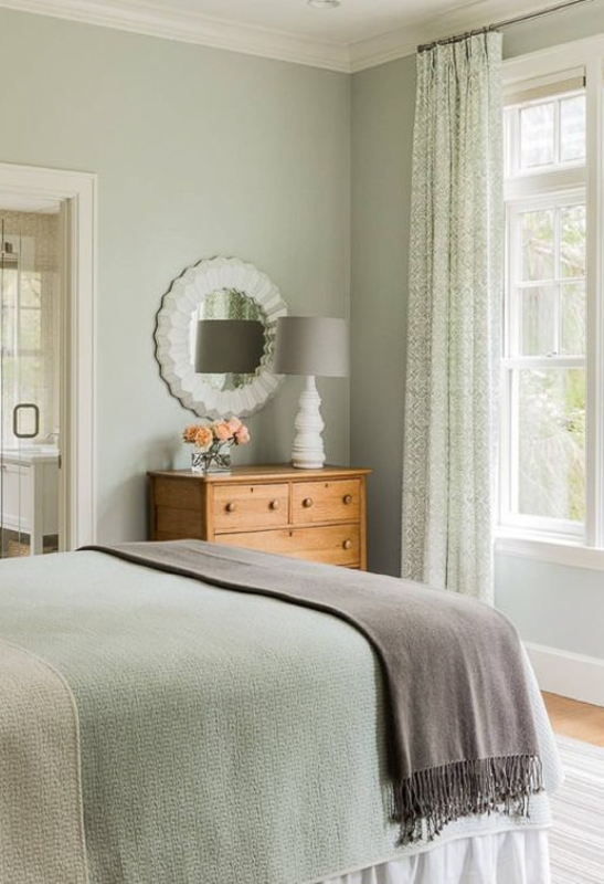Serene Sage Green Walls and Scalloped Mirror Design