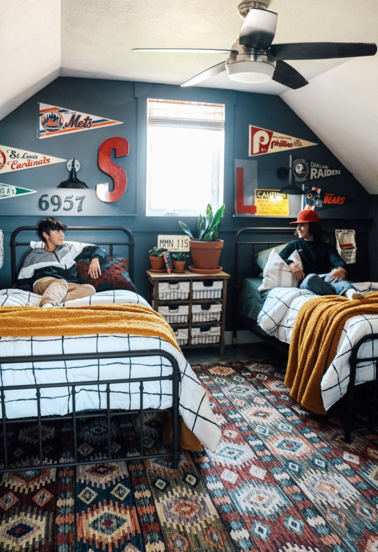 Shared Boys' Bedroom with Sloped Ceiling and Sports Pennant Wall