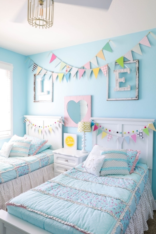 Shared Kids Bedroom with Ruffled Floral Quilts and Paper Bunting