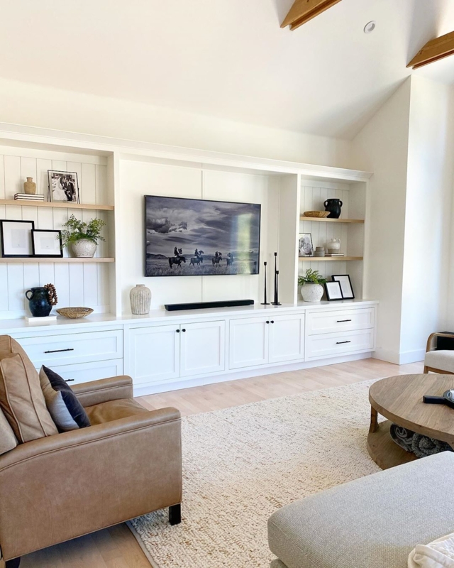 Shiplap Backed Built-in Shelving with Leather-Like Armchair