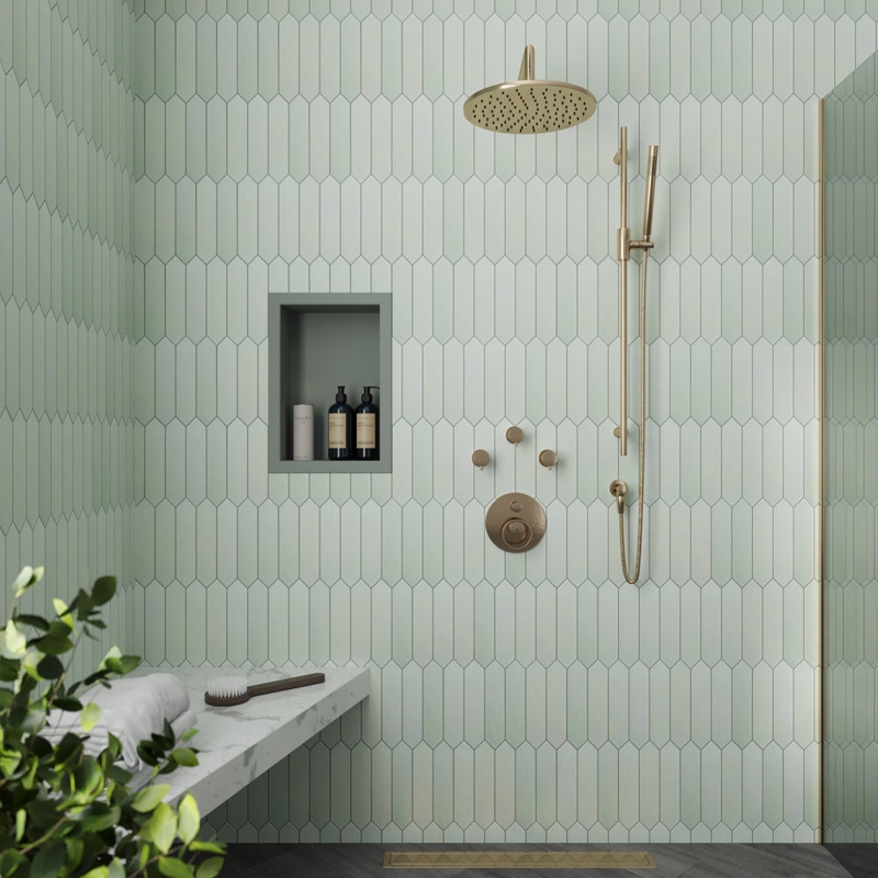 Shower Fixtures: Brushed Gold Set against Mint Green Picket Tile Wall