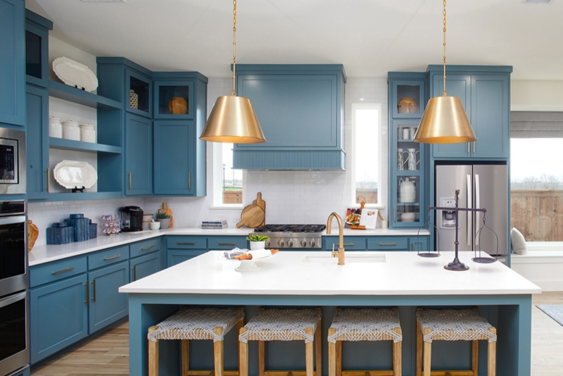 Slate Blue Kitchen Cabinetry with Large Gold Pendant Lights.