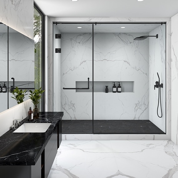 Sleek Black and White Bathroom with Large Format Marble Tile and Niche