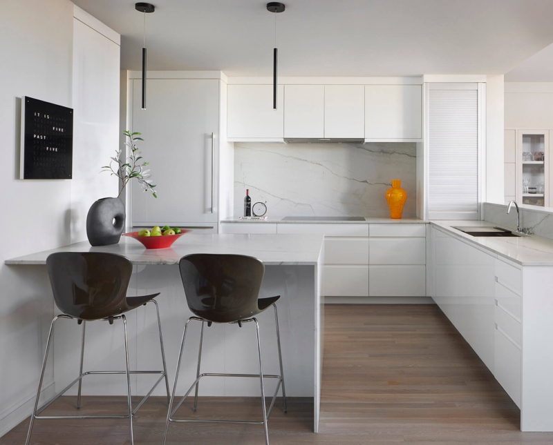 Sleek Kitchen with Marble Waterfall Island and Black Pendants