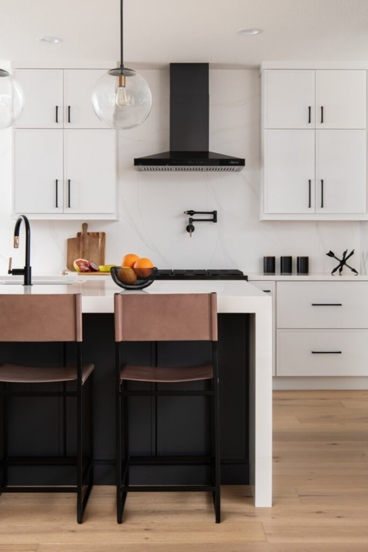 Sleek Kitchen with Waterfall Island and Matte Black Fixtures