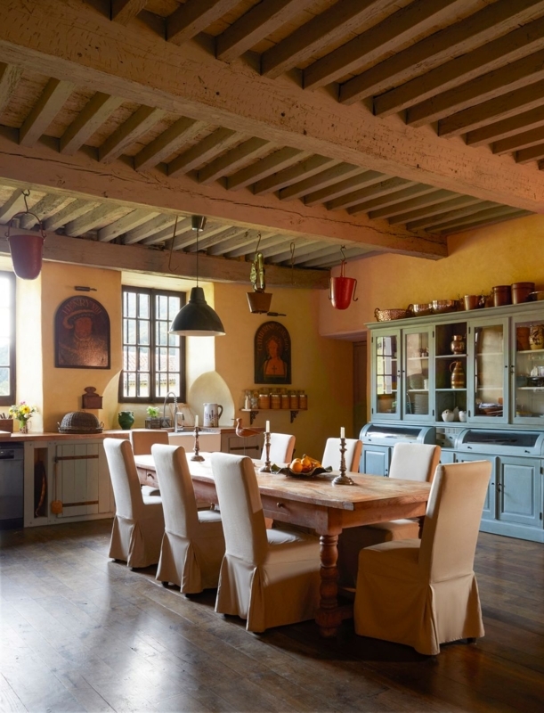 Slipcovered Dining Chairs in Farmhouse Kitchen with Exposed Beams