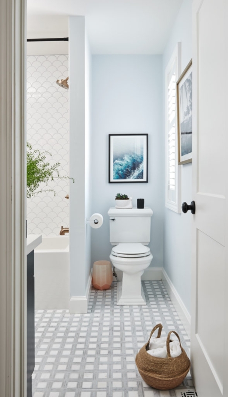 Small Bathroom Layout with light blue walls and geometric floor tile.