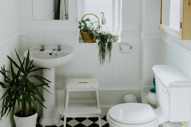 Small Bathroom with Beadboard Wainscoting and Checkered Floor