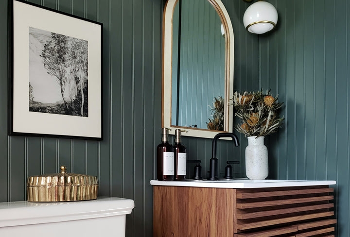 Small Bathroom with Slatted Wood Vanity and Deep Green Beadboard Walls