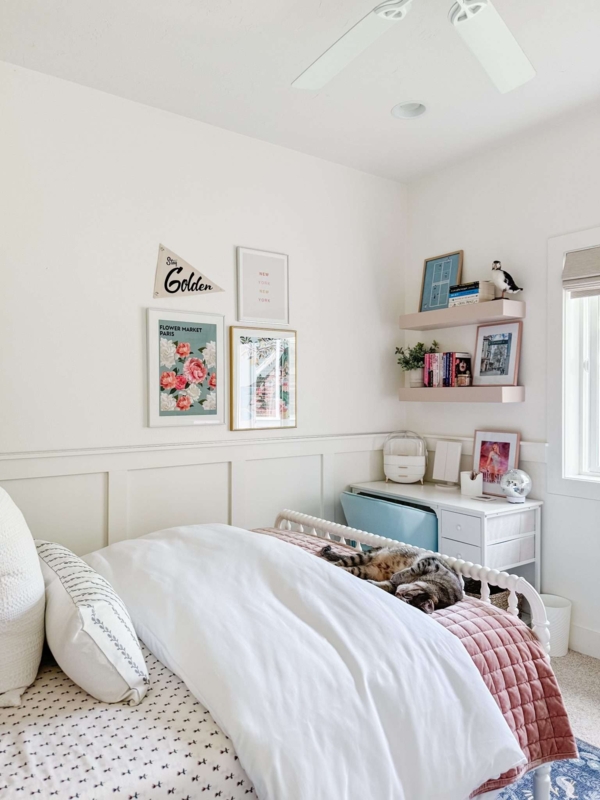 Small Bedroom Layout with Board and Batten Wainscoting and a Spindle Bed