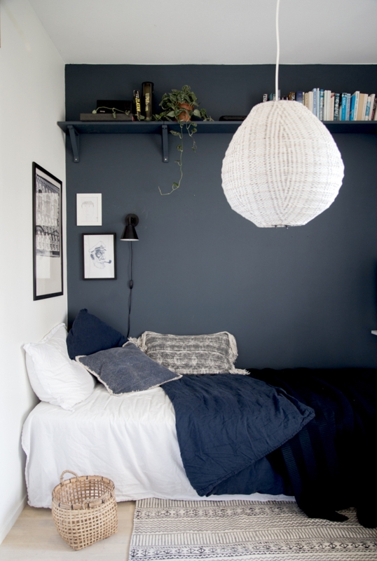 Small Bedroom Nook with Deep Charcoal Accent Wall and Woven Pendant