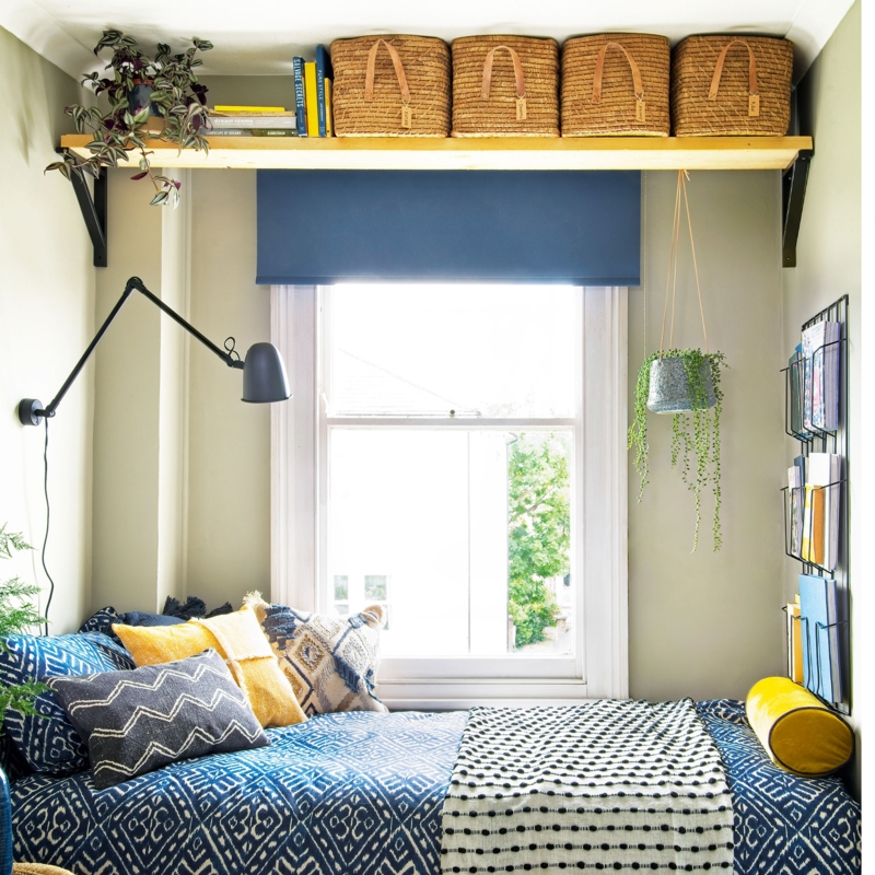 Small Bedroom Storage Shelf Ideas with Blue Ikat Bedding and Baskets.