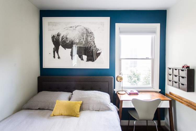 Small Bedroom with Blue Accent Wall & Oversized Bison Art