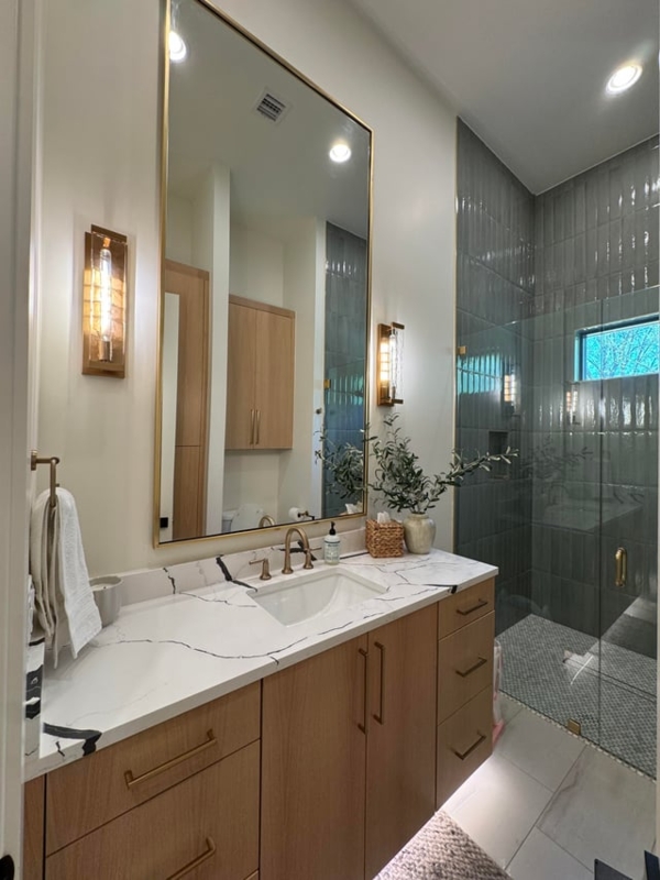 Small Guest Bathroom with Vertical Grey Tile and Gold Accents