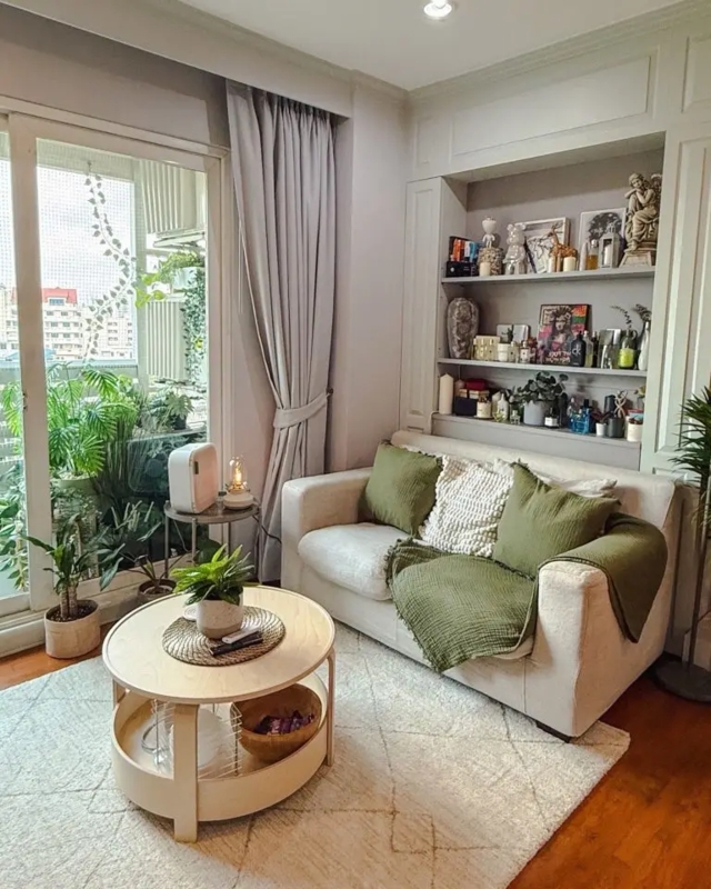 Small Living Room Layout with Integrated Shelving and Olive Accents