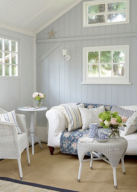 Small Living Room with Light Blue Paneling & White Wicker Accents