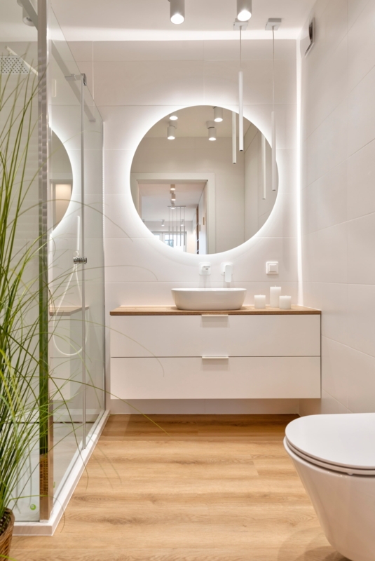 Small Modern Bathroom Design with Backlit Mirror and Floating Vanity