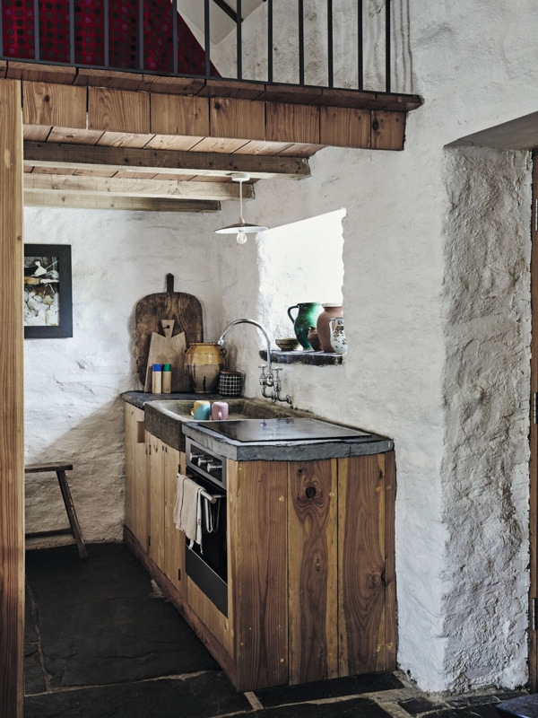 Small Rustic Kitchen with Stone Trough Sink and Exposed Wood Loft
