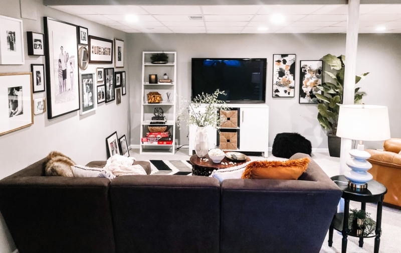 Small Space Gallery Wall Layout in Cozy Basement with Ladder Shelf