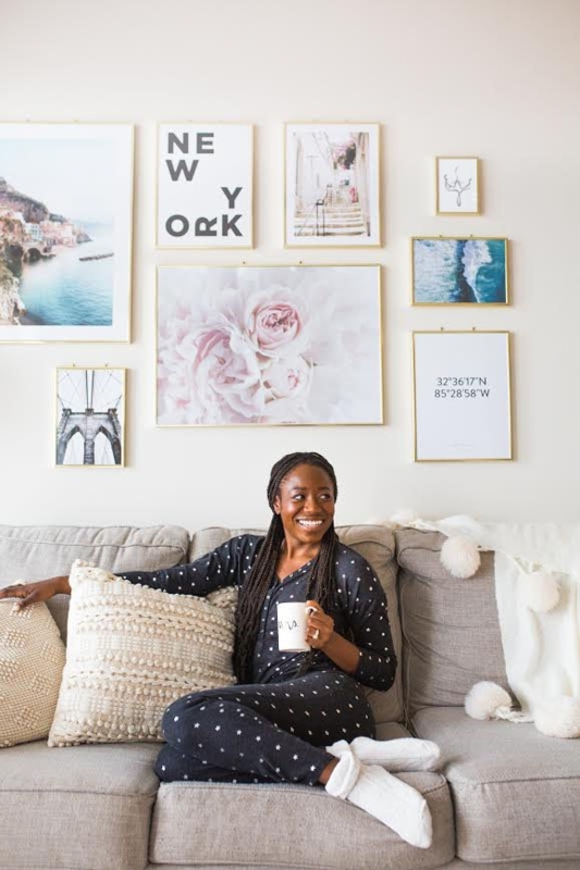 Small Space Gallery Wall Layout With Gold Frames And Pom Pom Textiles