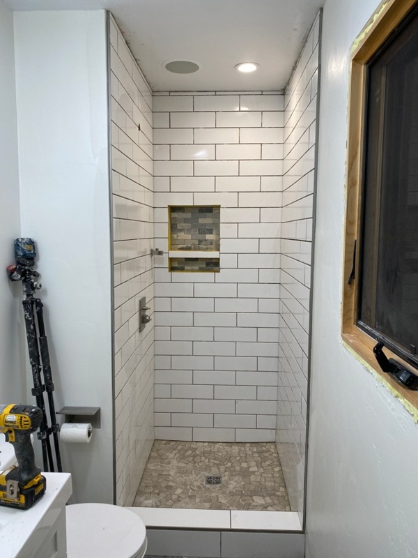 Small Walk-In Shower Design: Subway Walls & Pebble Floor Tile