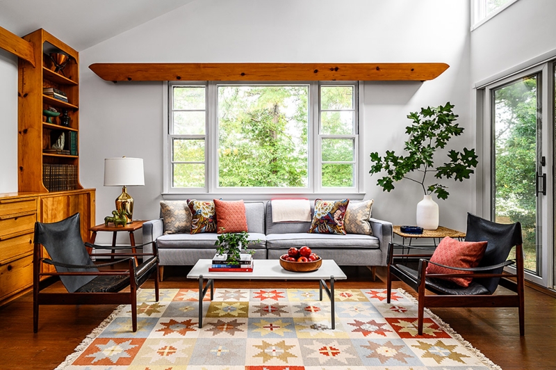 Sofa in Mid-Century Modern Living Room with Geometric Star Rug & Beam