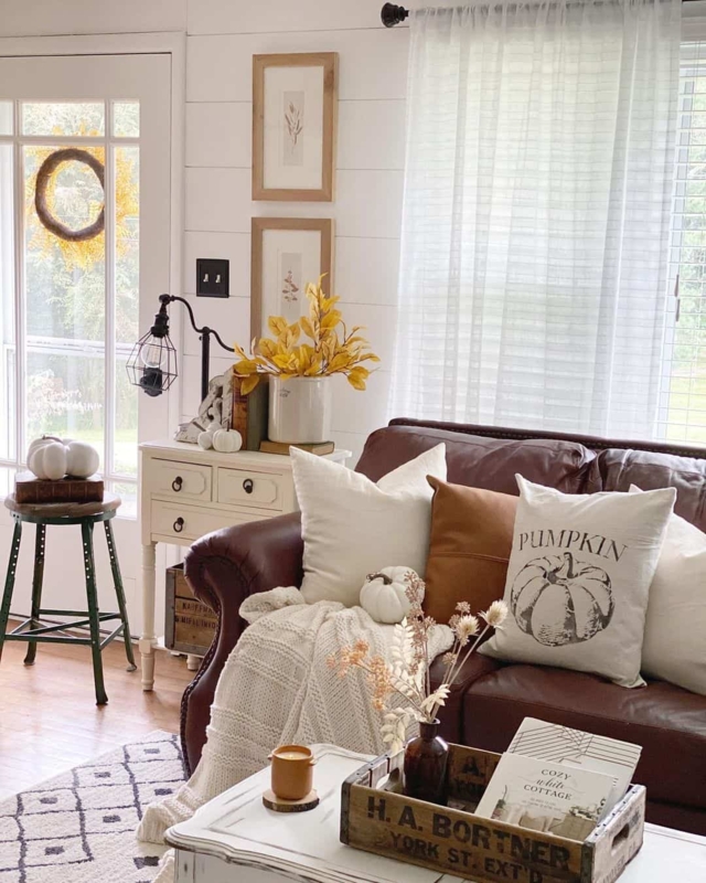 Sofa Leather Like Farmhouse Style with Shiplap Backdrop and Fall Decor.