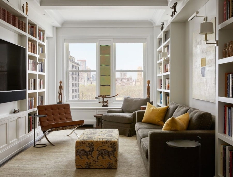 Sofa Leather Like in Library Living Room with Built-in Bookshelves.