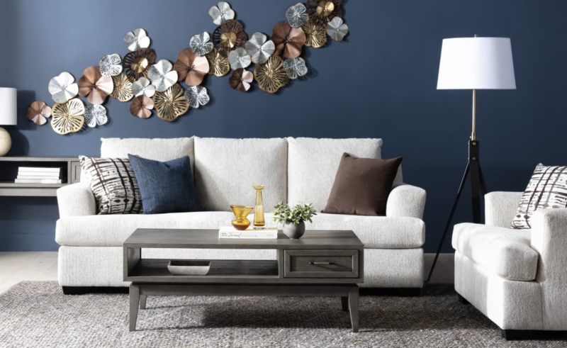 Sofa Off-White with Metallic Floral Wall Art and Navy Blue Accent Wall