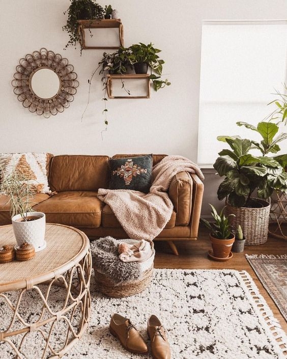 Sofa Tan Leather Rattan Coffee Table Lush Indoor Plants Boho
