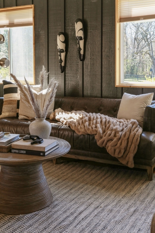 Sofa Tufted Leather Like with Ribbed Wood Pedestal Coffee Table.