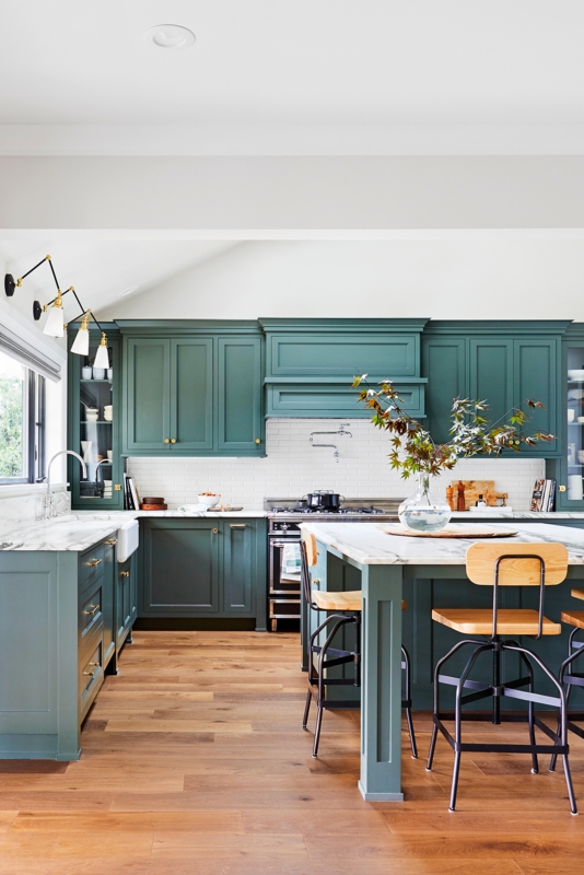 Sophisticated Kitchen with Deep Teal Cabinets and Hardwood Flooring