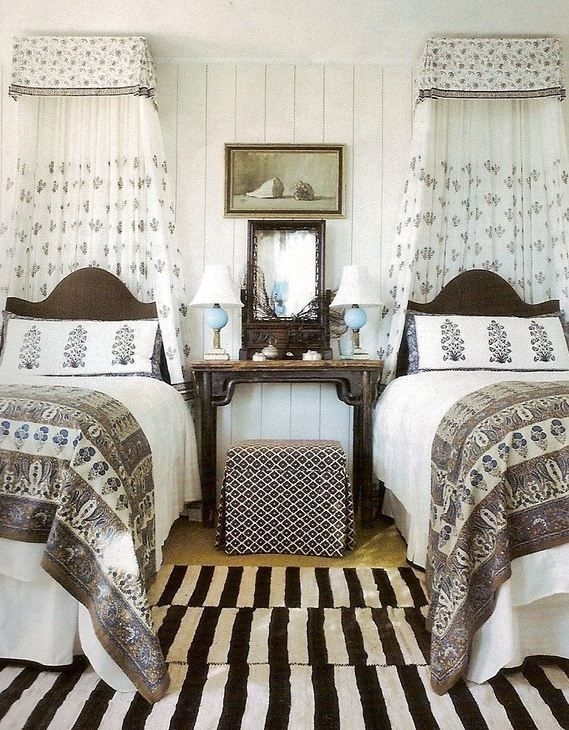 Sophisticated Twin Bedroom with Floral Canopies and Vertical Shiplap